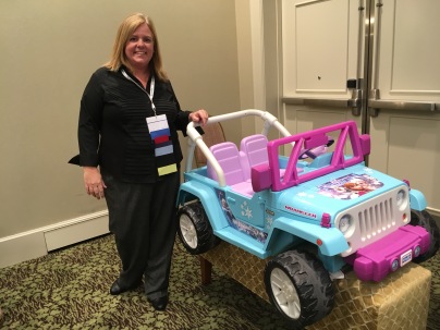 Lori Binko of Lesson Pix with an adapted car that was funded by Easterseals